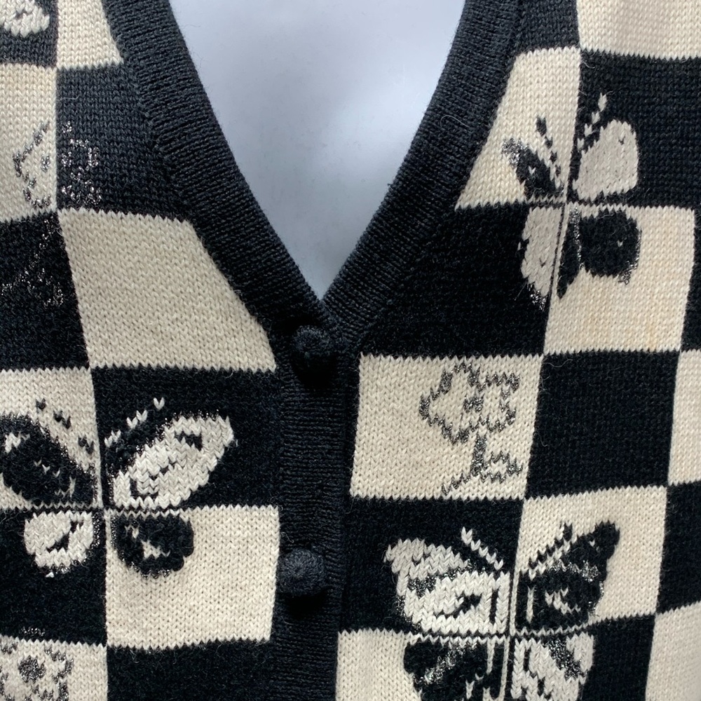 Sleeveless sweater with butterflies